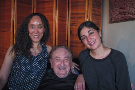 UC Law SF 3Ls Mica Williams (left) and Katayoon Hemati (right) make a home visit to veteran client Mark Brown (center).