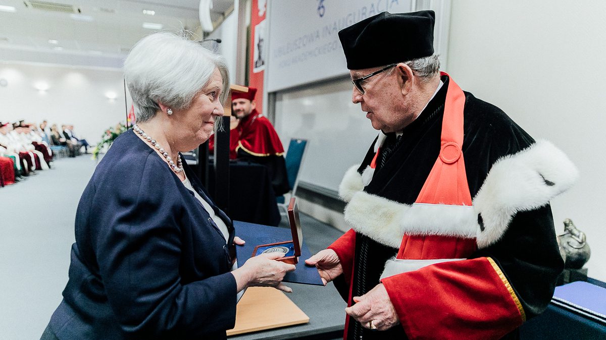 Mary Kay Kane being presented with a medal of honor from the Kozminski University in Warsaw, Poland.