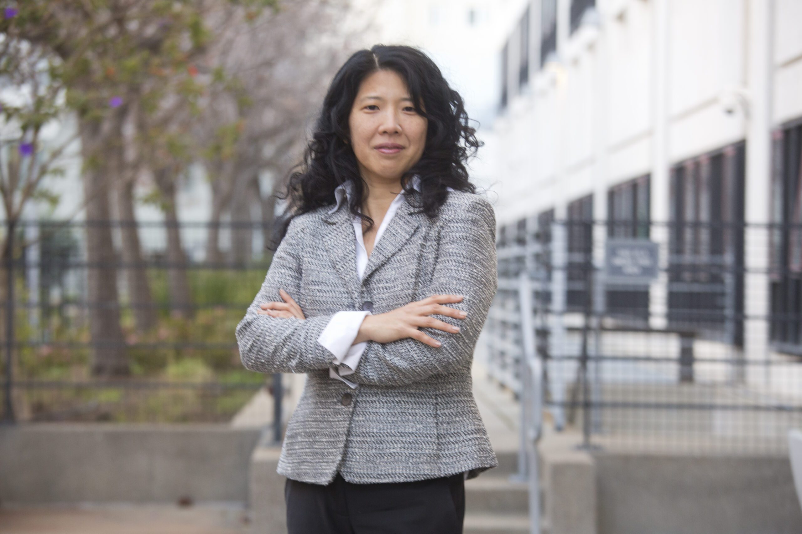 Former UC Law SF Clinical Professor Eumi Lee outside a building.