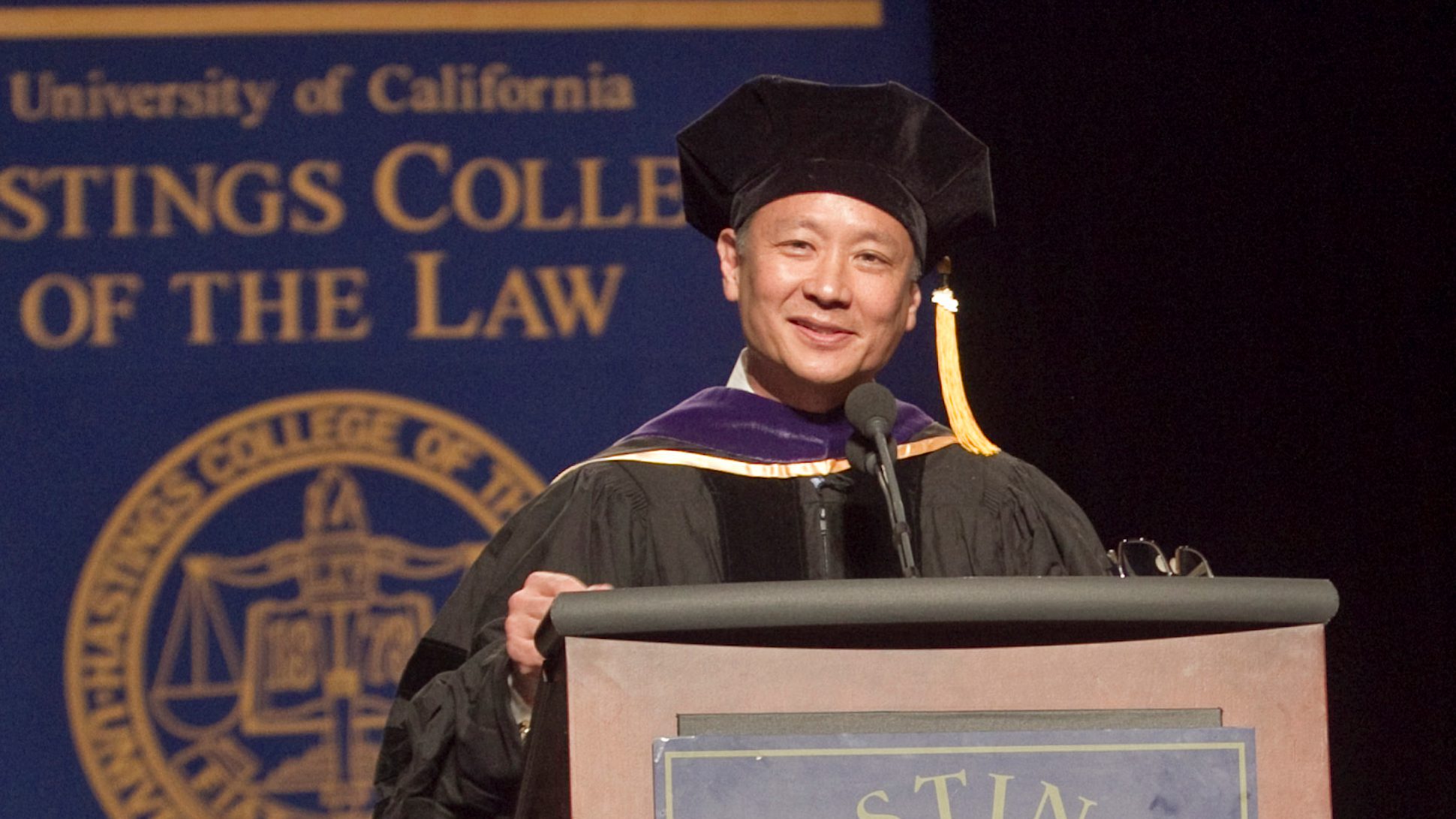 Jeff Adachi in front of podium.