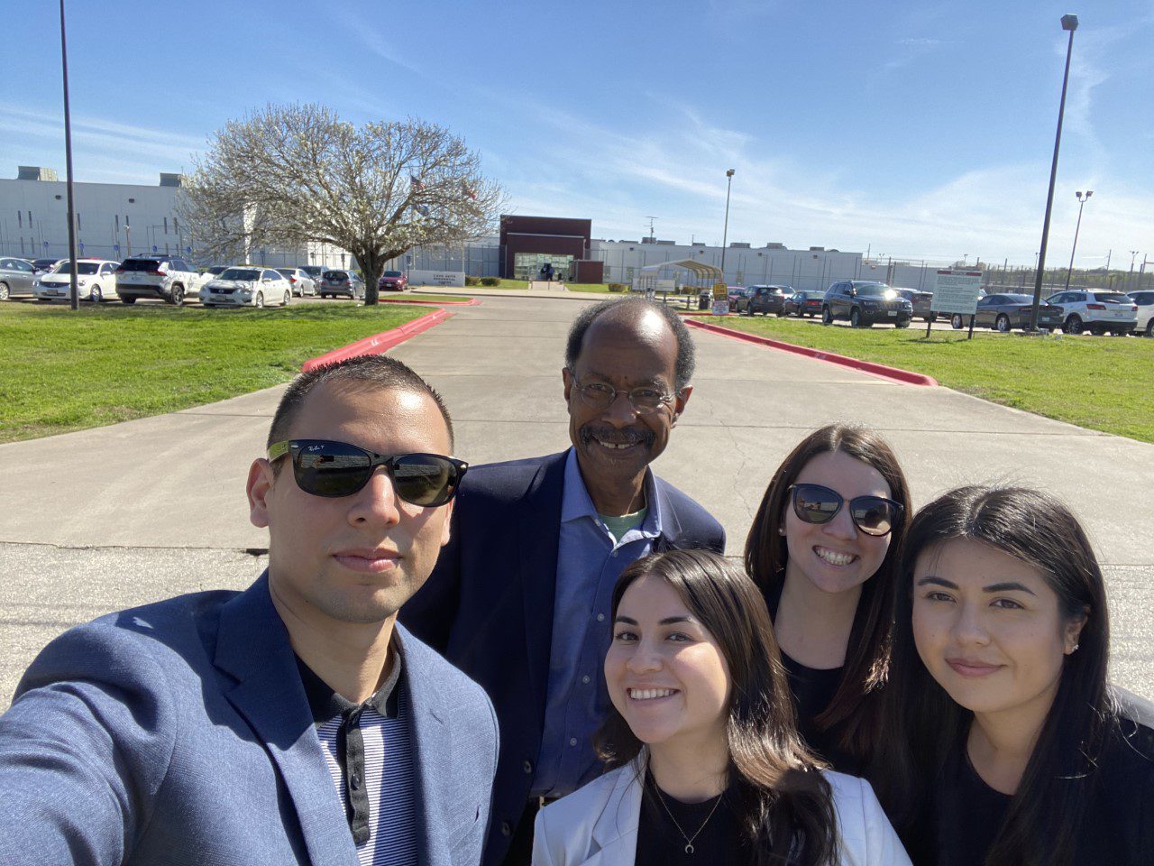 Group photo of students and professor