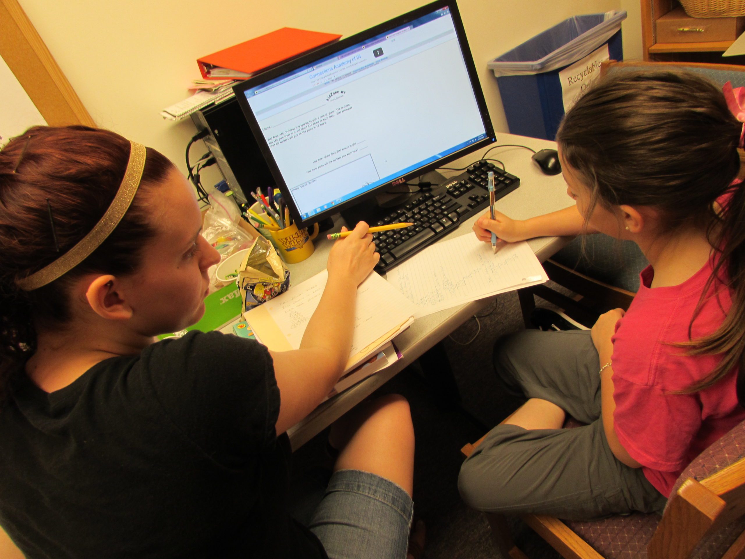 photo of mother and child doing school work