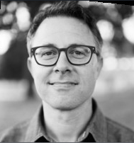 Jared A. Goldman, appointed as general counsel at the California Health and Human Services Agency, smiling in a blurred outdoor setting.