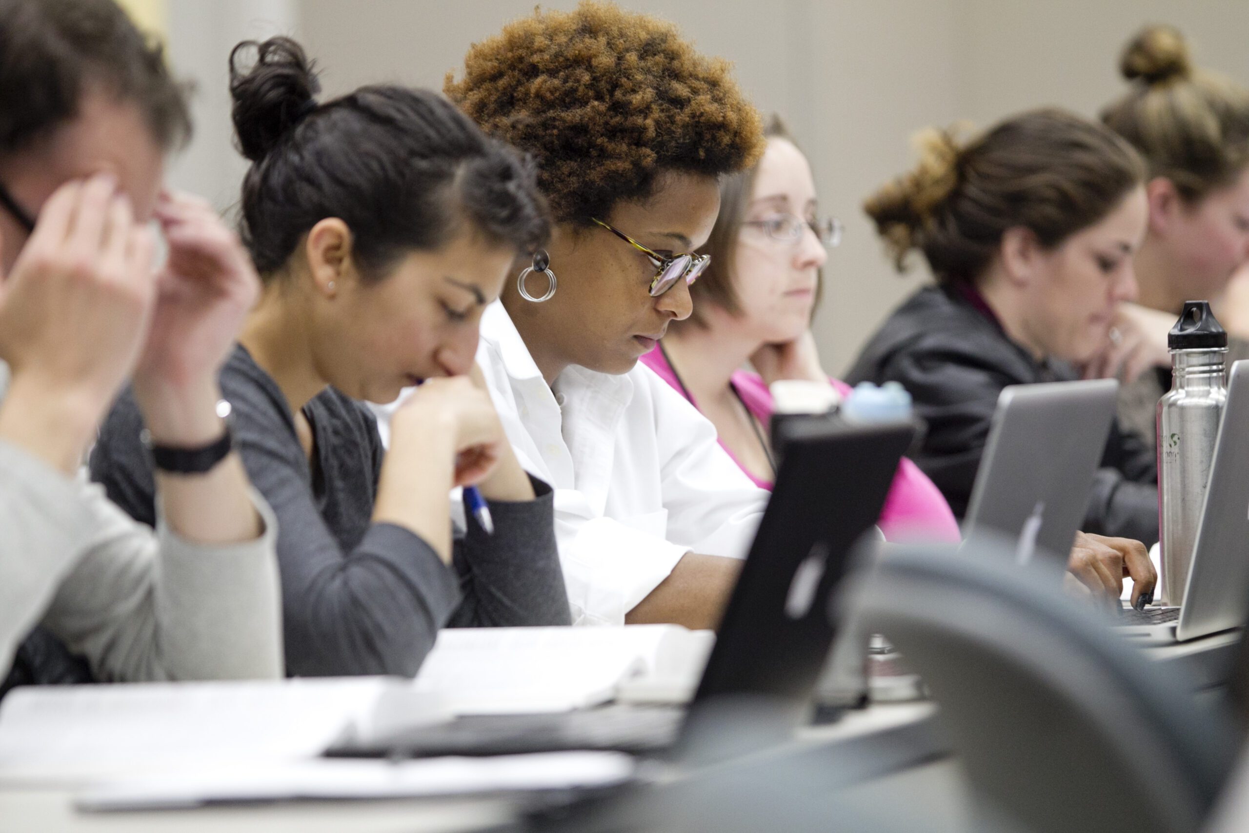 Students in classroom focusing on work