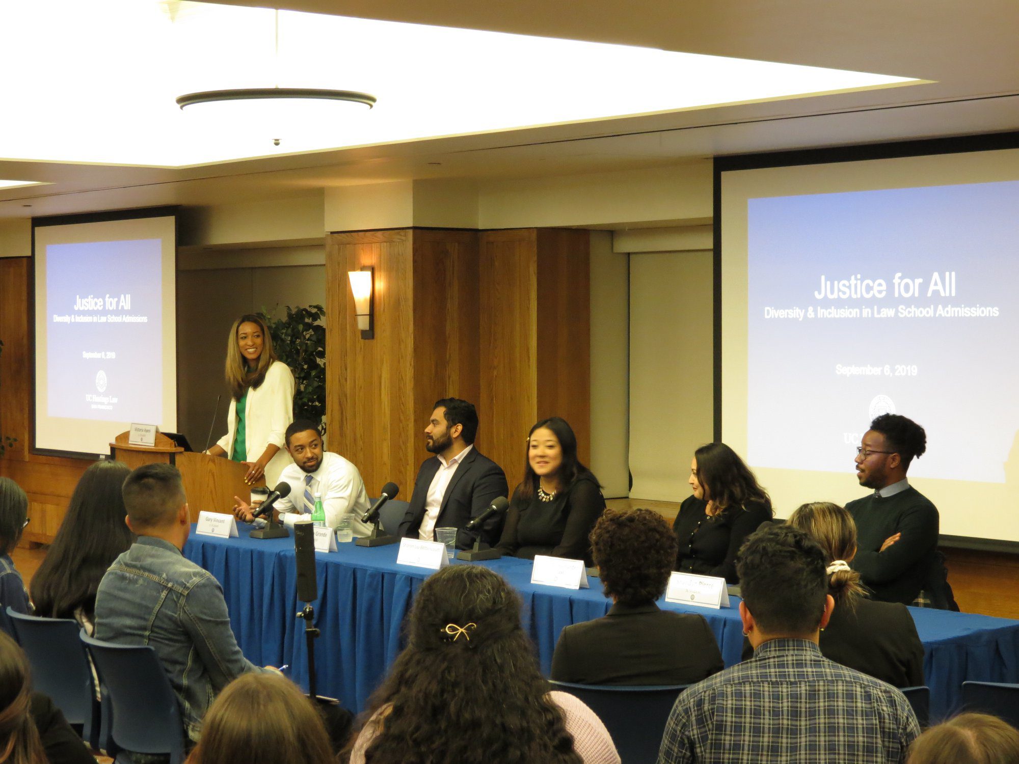 justice for all panel, students sitting, panelists sitting and talking to room