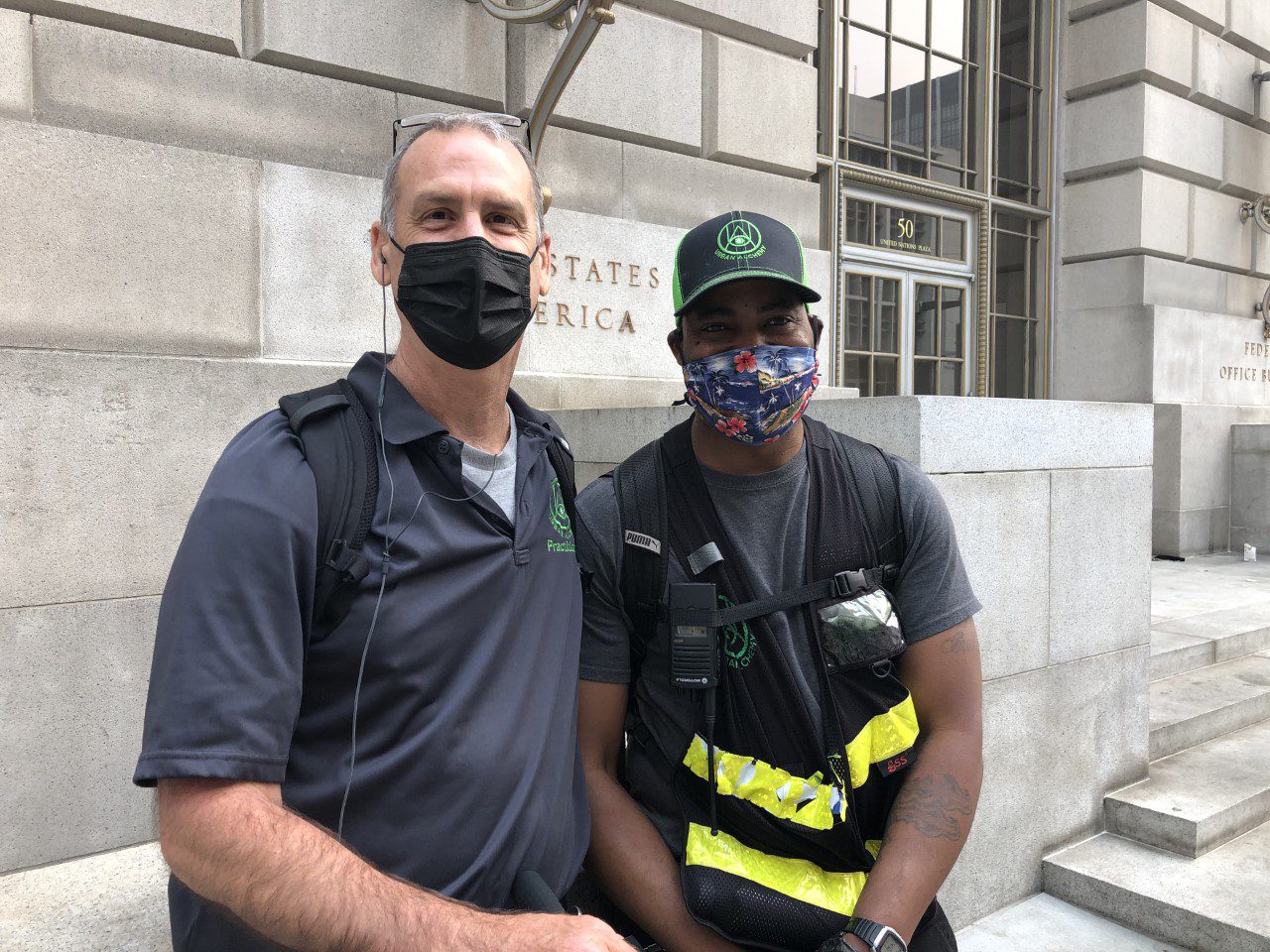 Two Urban Alchemy practitioners across from UC Law SF