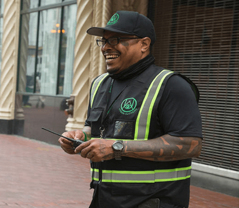 A smiling Urban Alchemy officer