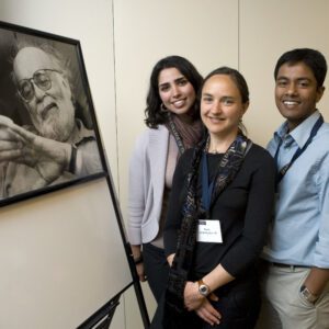 Abascal fellows pose next to a picture of Abascal