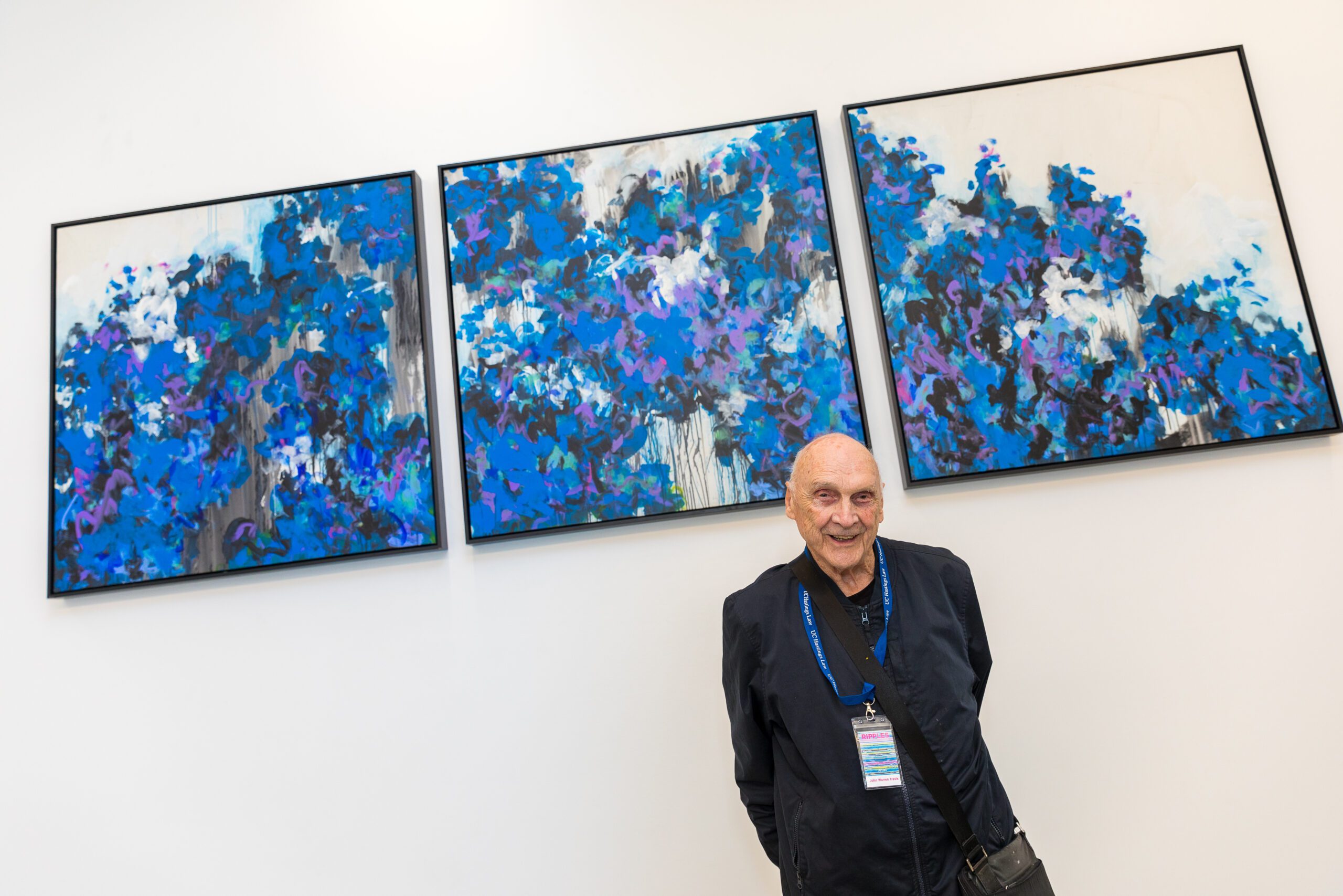 man smiling with frames above