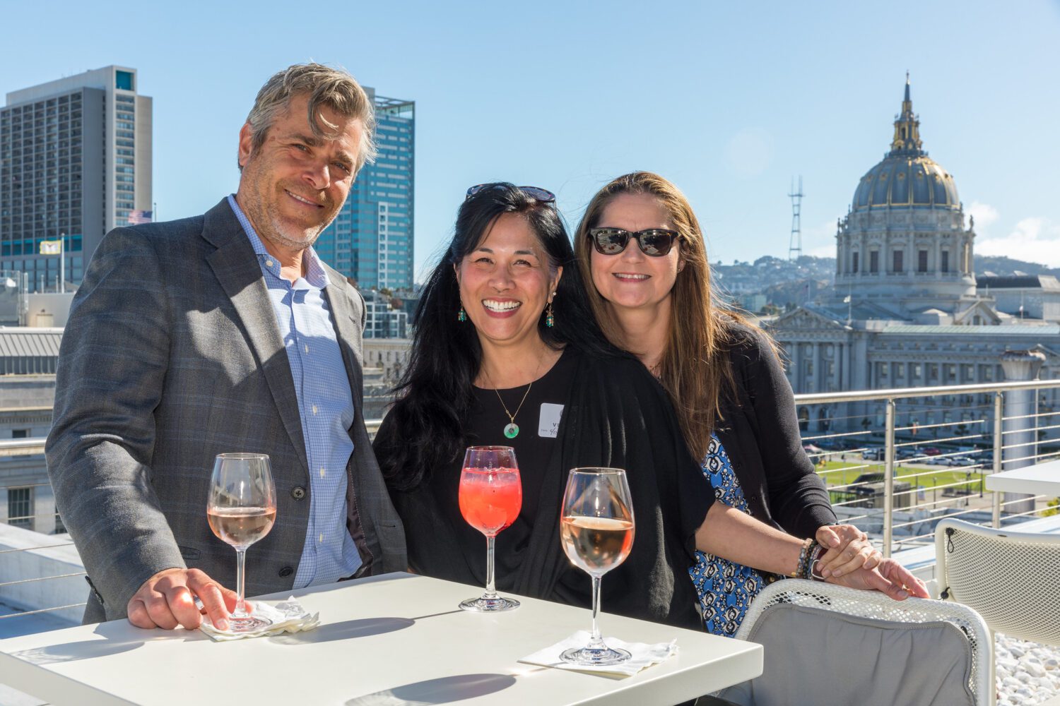 Eric Dumbleton, Jolene Yee and Olga Rodriguez-Aguirre pose at a UC Law SF Alumni spring week event