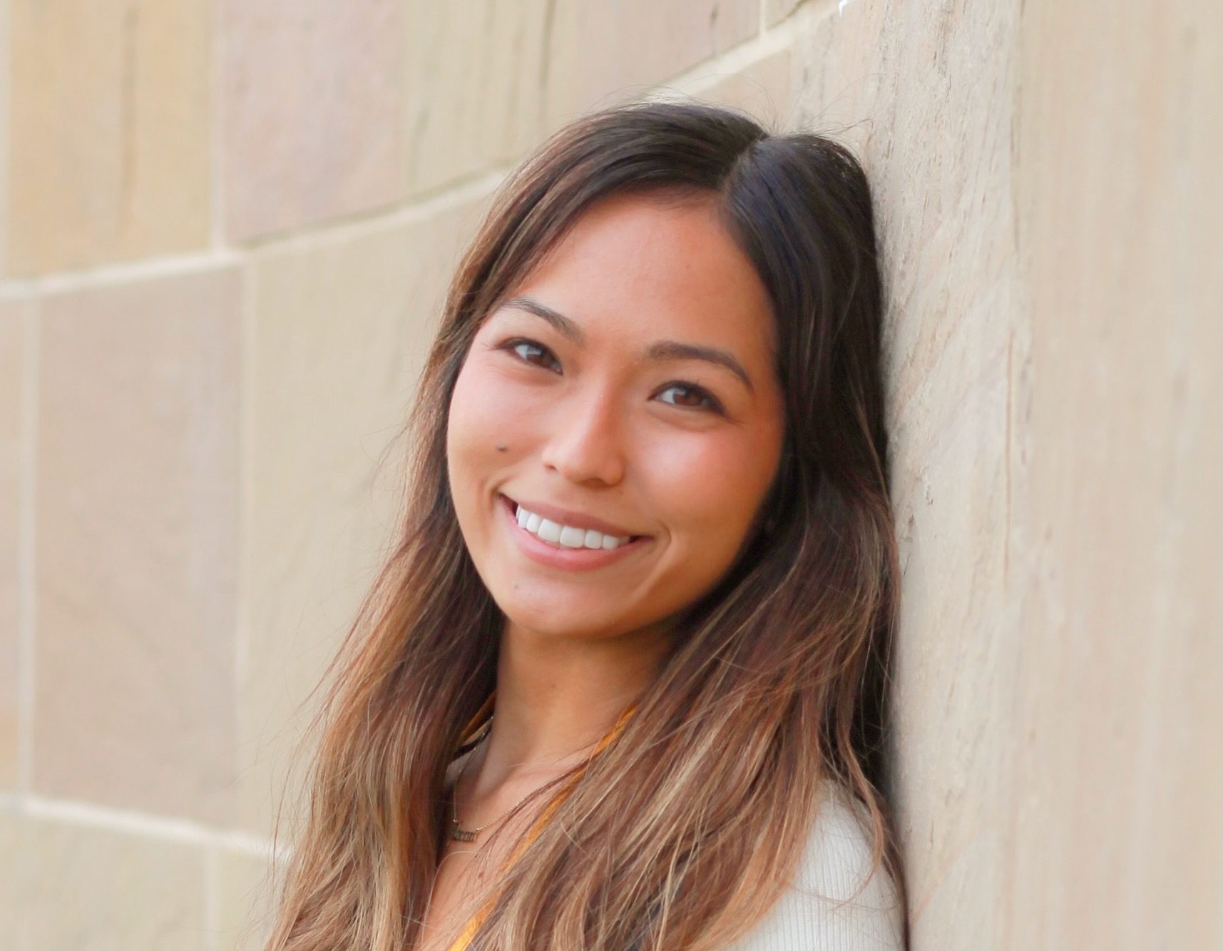 Young Hawiian woman smiles on graduation day