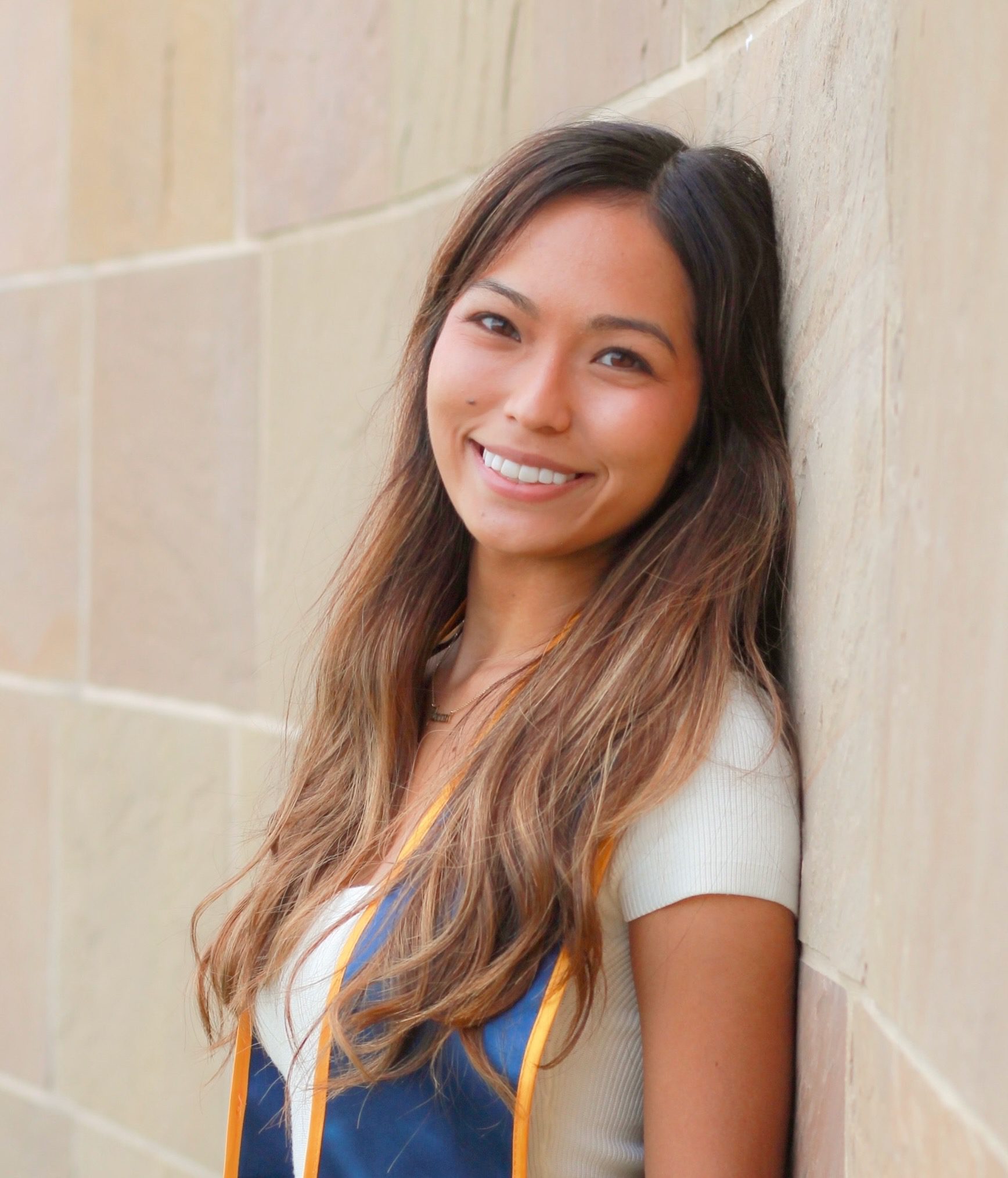 young Hawiian woman smiles on graduation day