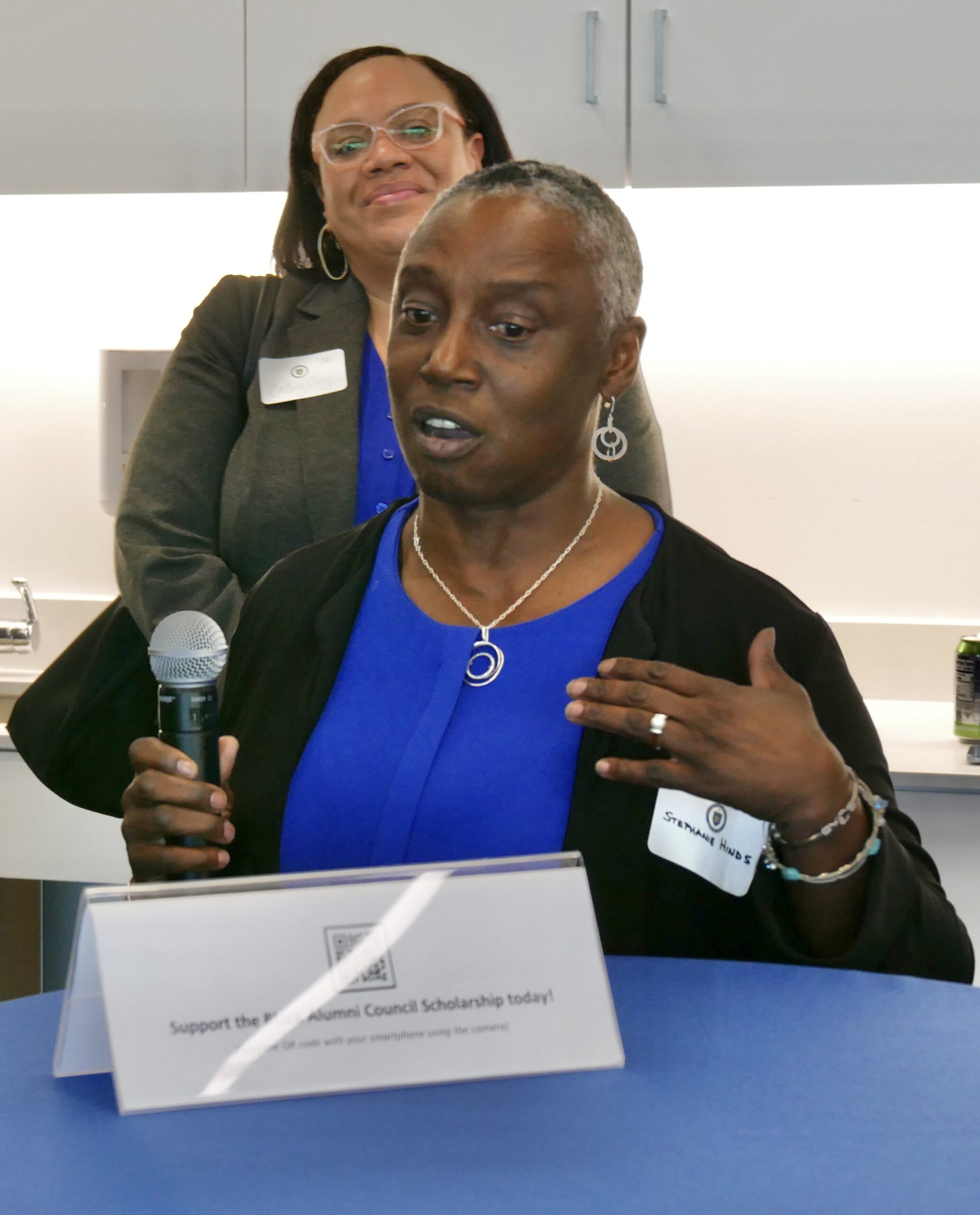 UC Law SF alumna speaks at a scholarship launch event, promoting the Black Alumni Council Scholarship and engaging with attendees.