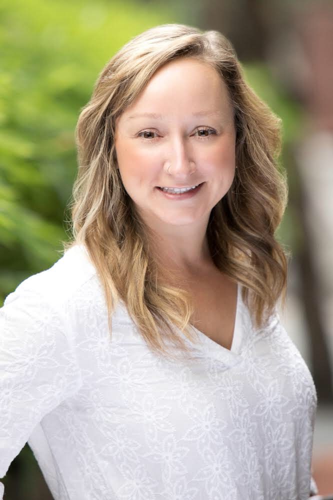 headshot of smiling white woman