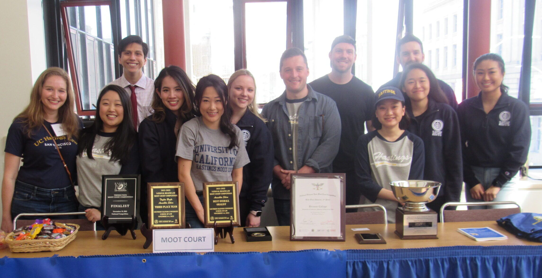 Trial team standing and smiling to the camera