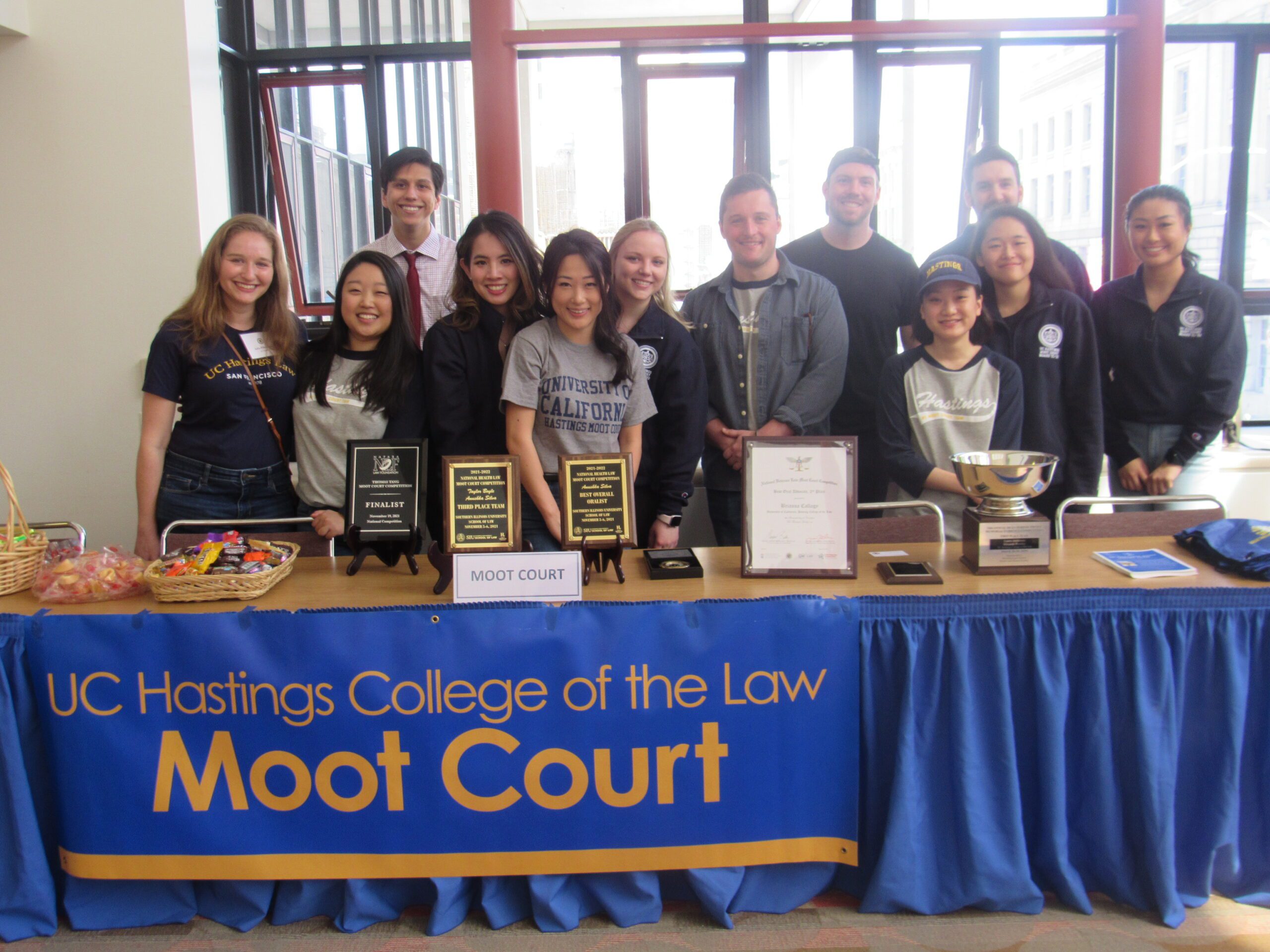 Trial team standing and smiling to the camera