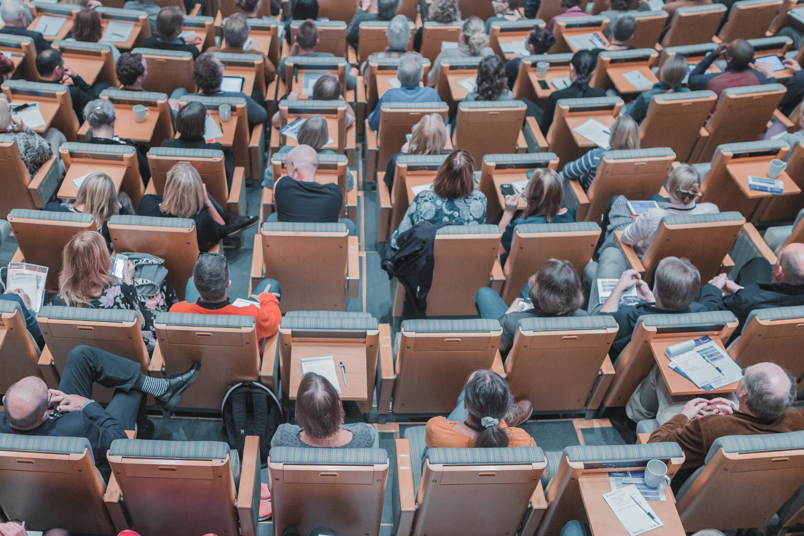 top down look at people sitting in an auditorium