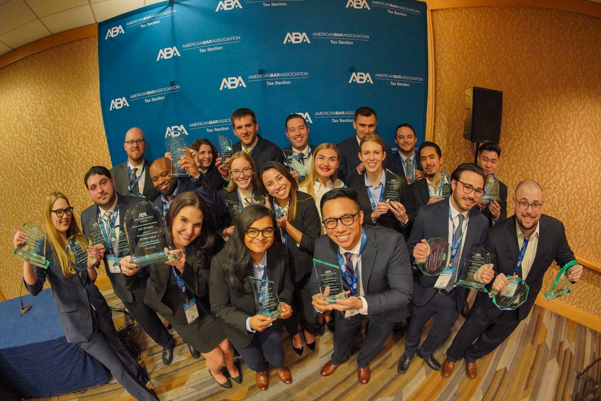 ABA Law Student Tax Challenge students holding up their awards and smiling at the camera