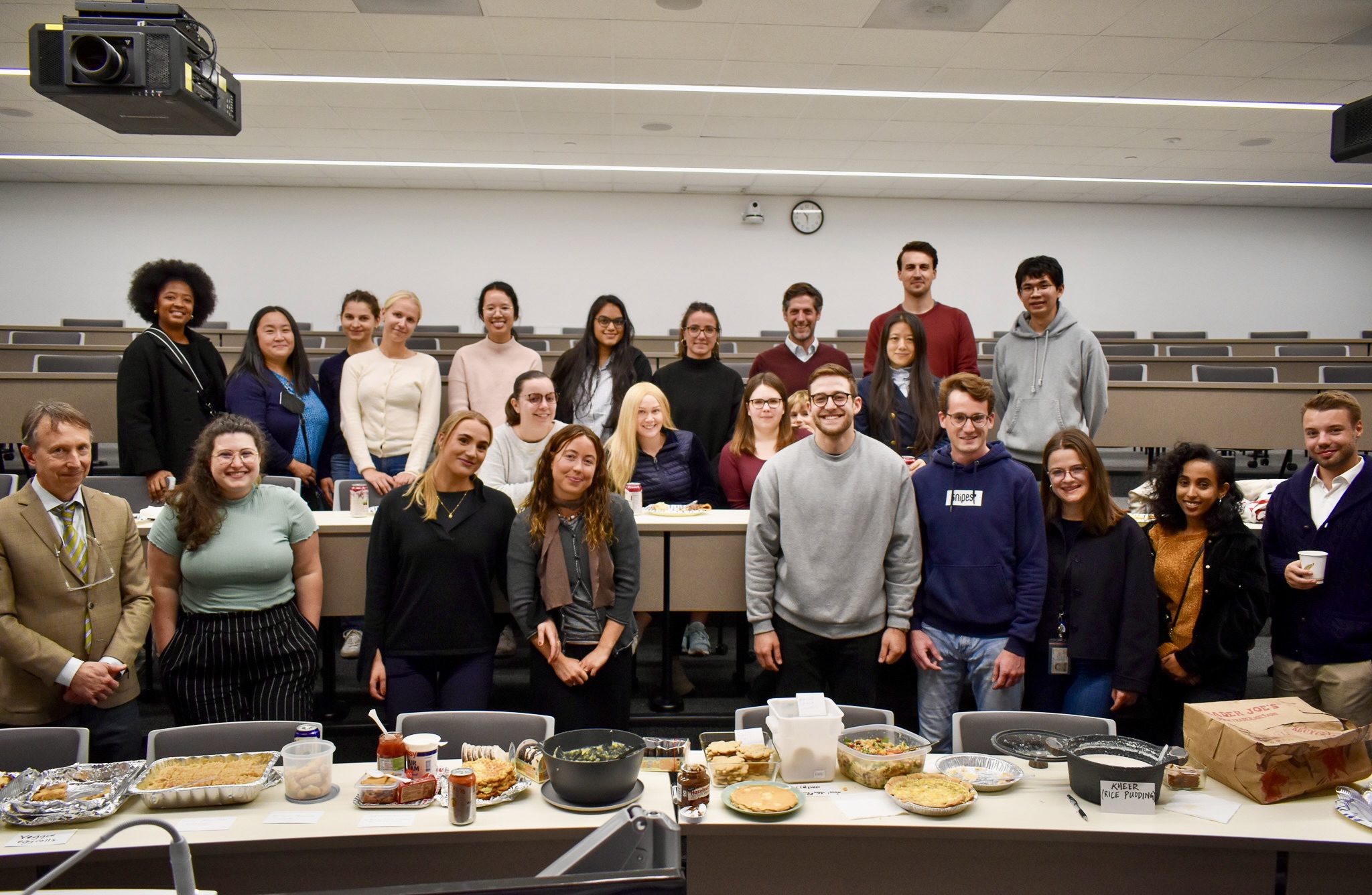 Dozens of international law students joined faculty and staff members for a pre-Thanksgiving Day potluck in a classroom surrounded by food.