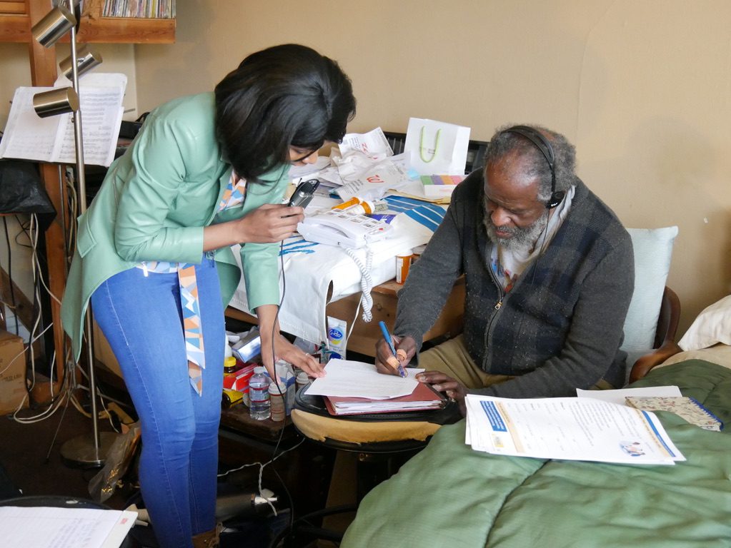 Kuwabo Mubyana helped client Patrick Prescod sign legal documents