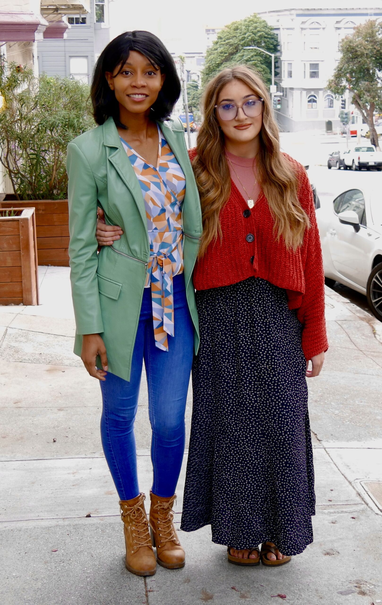 Clinic students Kuwabo Mubyana and Sophia Tarantino pose outside of their client Patrick Prescod's home in San Francisco's Western Addition neighborhood.