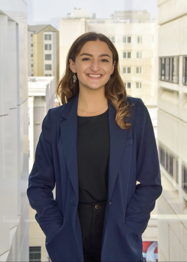 Talia Horrow standing on the campus skybridge.