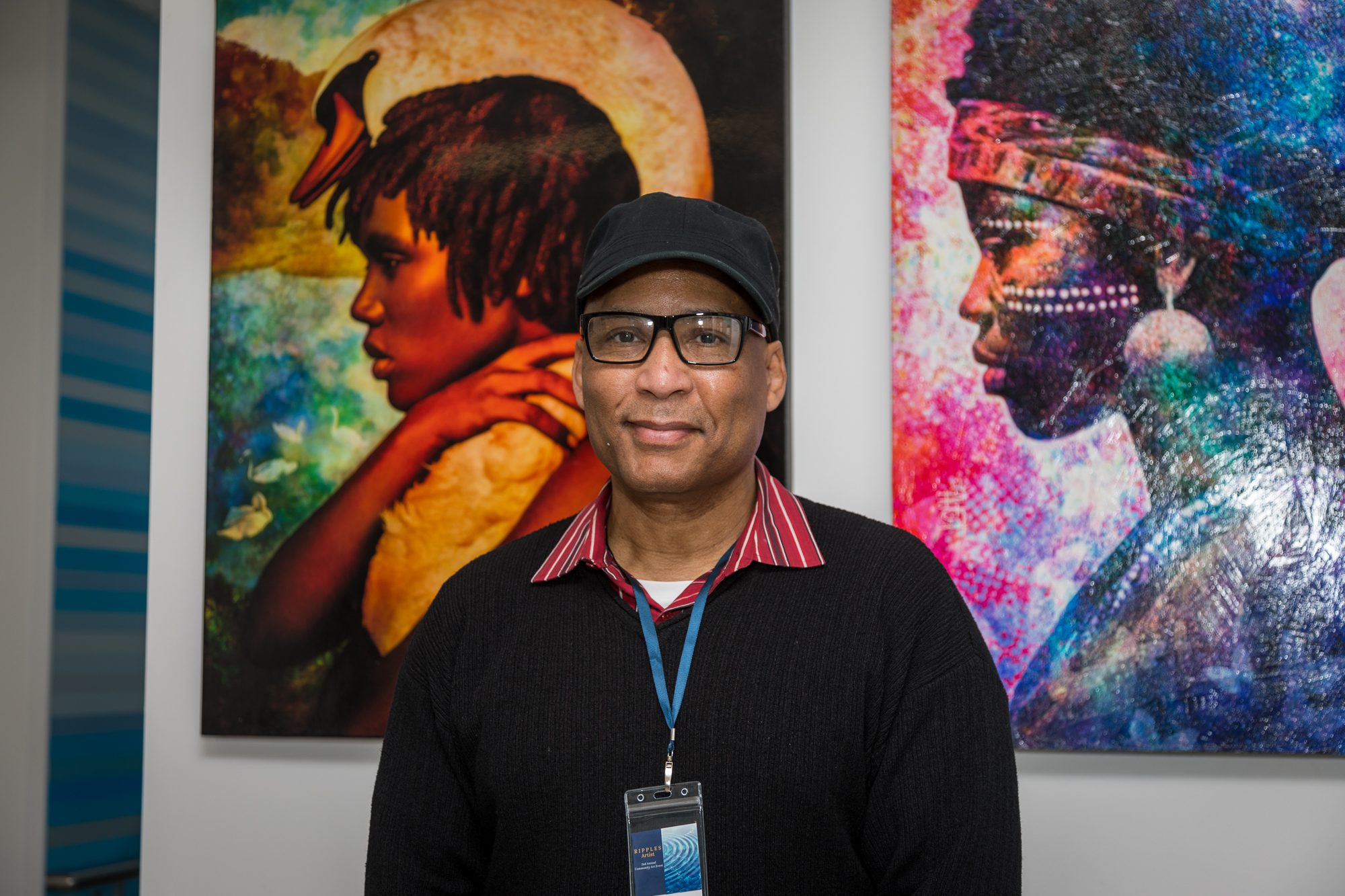 Artist David Bruce Graves in front of his pieces “Black Swan” and “Queen of Dreams,” which are on display in the Cotchett Law Center.