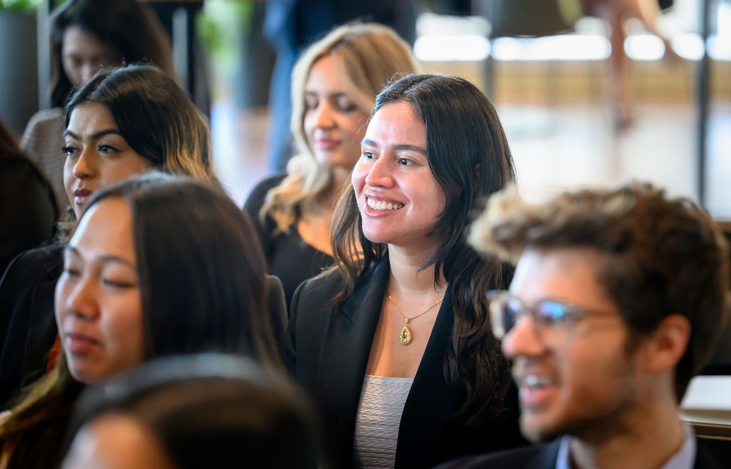 Student smiling at an orientation session