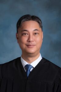 Headshot of Steven Chu in judicial robes.