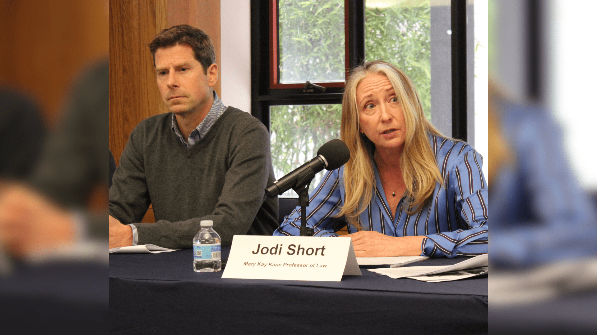 Dave Owen and Jodi Short seated at a table leading a panel.