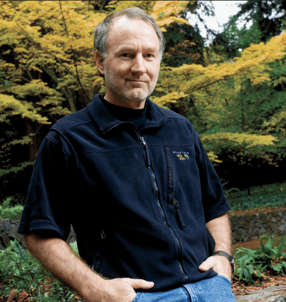 A photo of UC Law SF alum Mike Wood in casual clothing posing outdoors in front of a tree.