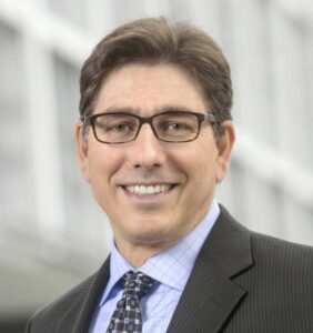 headshot photo of David Faigman wearing a suit and tie