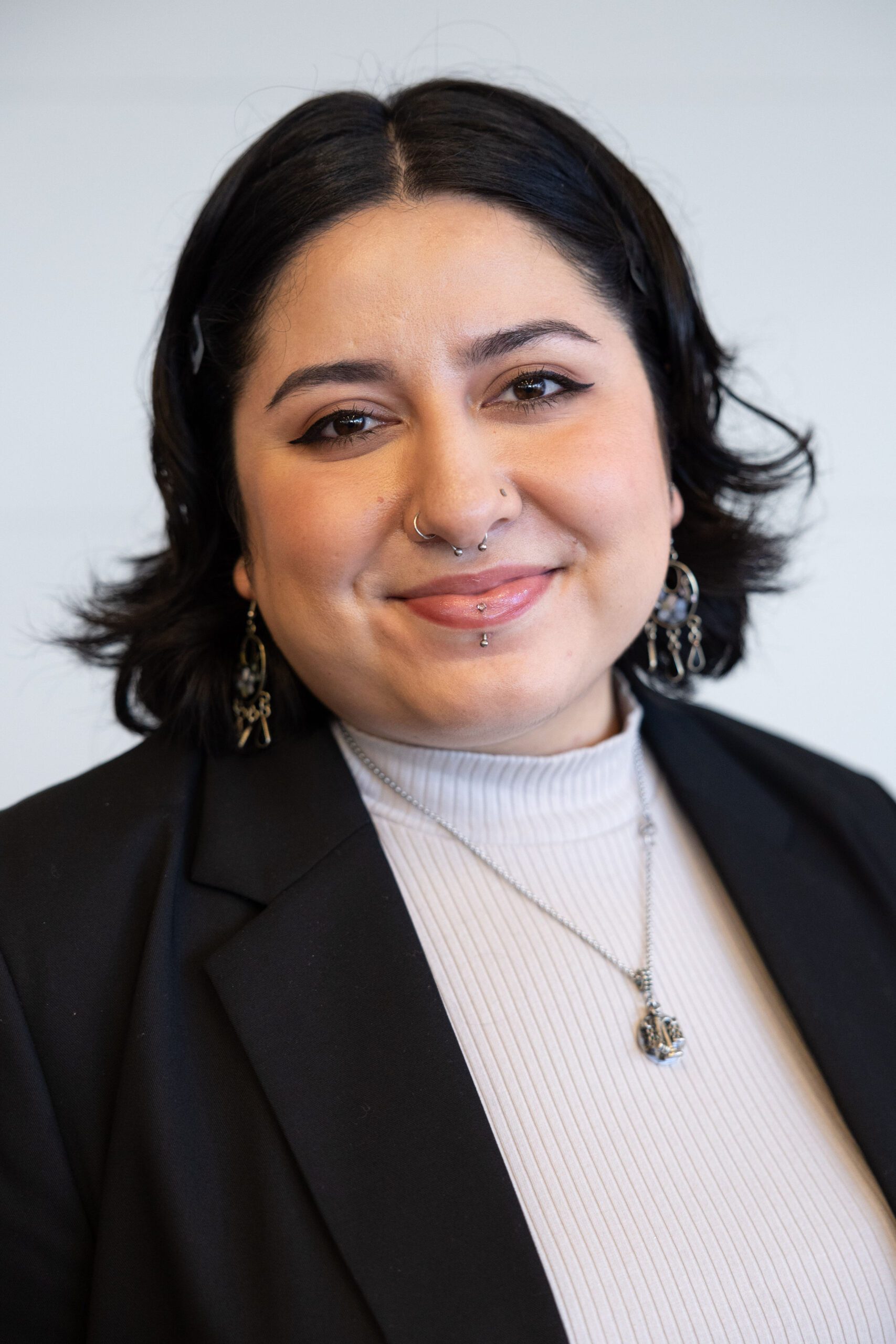 Headshot of Nimsi Garcia Sandoval wearing professional business attire