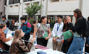 A group of 1L students talking to an upper class student about journal involvement
