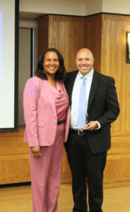 Elizabeth McGriff and Mario Lopez in the Alumni Reception Center. Mario holds a LEOP Luminary Award