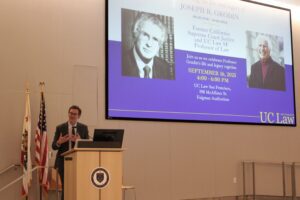 Reuel Schiller speaks behind a podium.