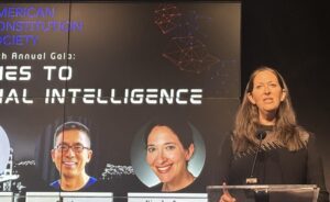 Nicole Ozer speaks behind a podium.