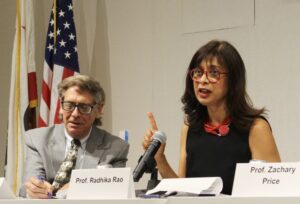 Professors Rory Little and Radhika Rao seated behind a table with microphones.