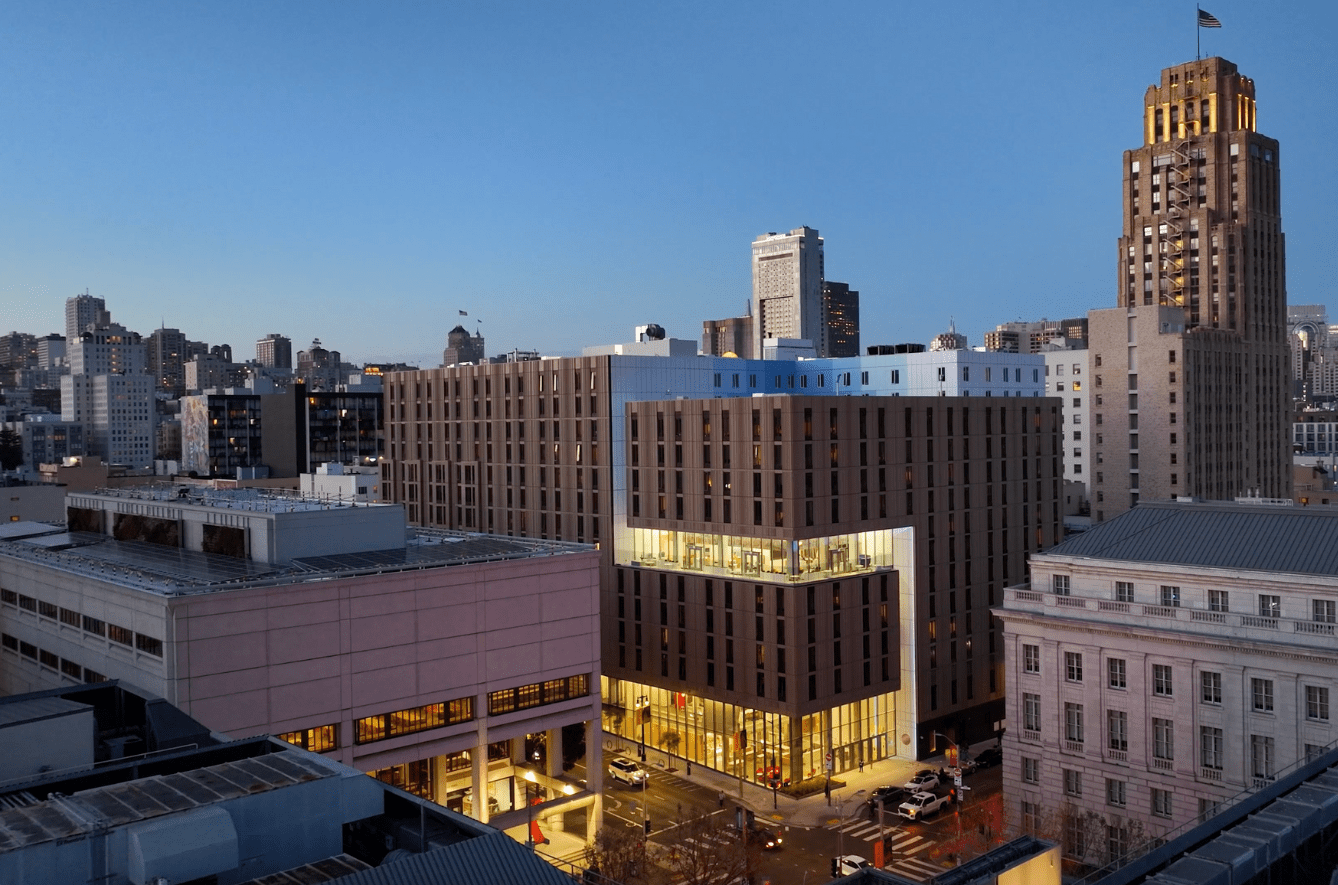 An aerial view featuring 200 McAllister, 198 Mcallister, and 100 McAllister at dusk.