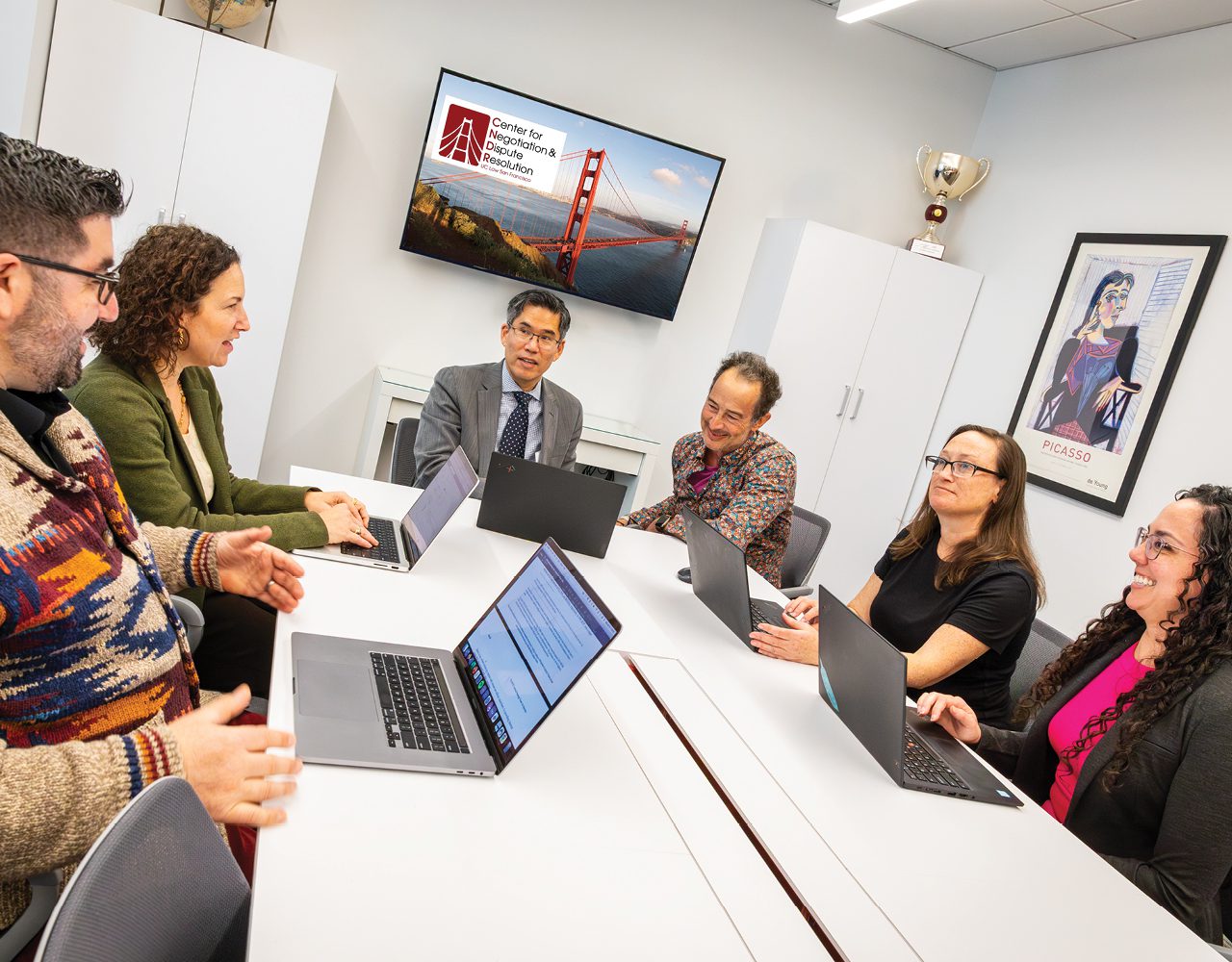 A group of scholars sitting around a table