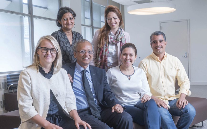 A group of people looking at the camera and smiling