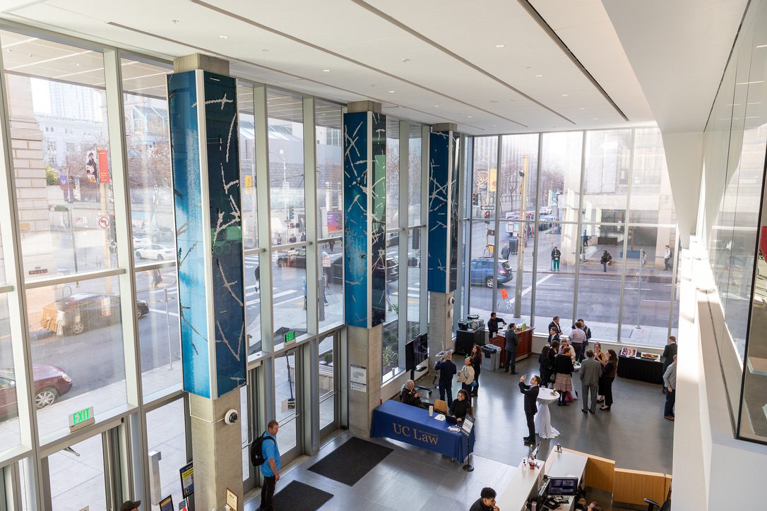 A photo of blue and white wave patterns appearing on three pillars in the lobby of the 198 McAllister building.