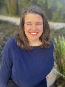 3L Rachel Sadler wearing a blue shirt outside.