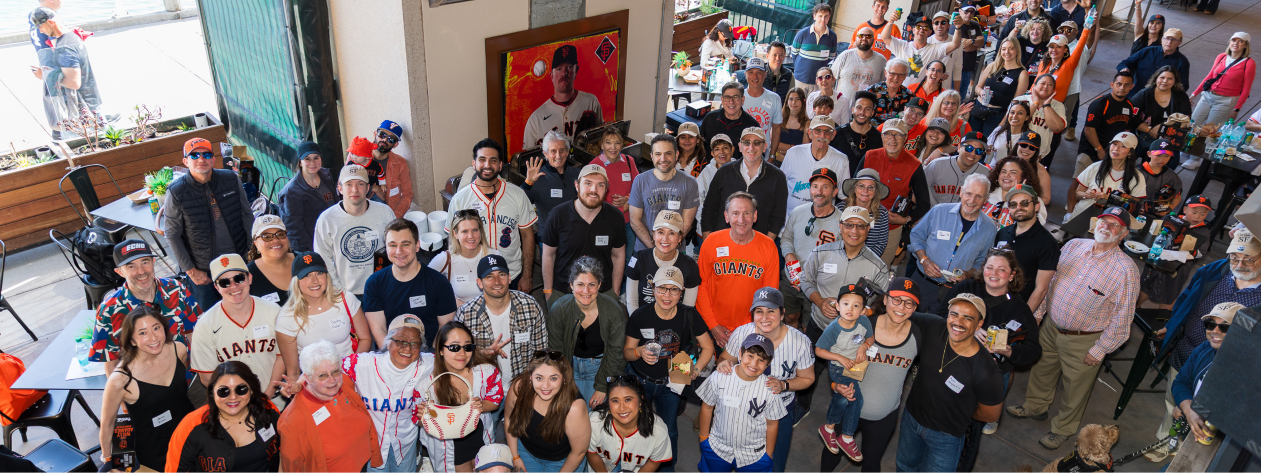 A large group of UC Law SF alumni and friends at Oracle Park's Triples Alley for the annual Giants Game during Spring Week