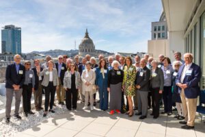 This photo shows the Class of ’76 alumni on the Sky Deck of UC Law SF's Cotchett Law Center.