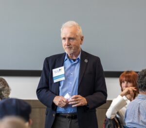 John Koeppel speaks during an alumni luncheon event.