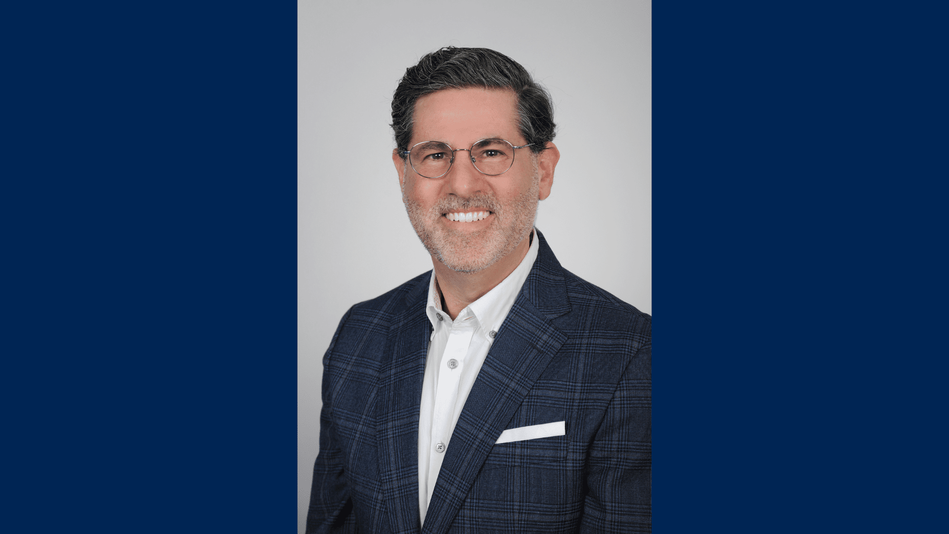 This is a headshot of Professor Jeffrey Lefstin, wearing a suit and glasses in front of a white background.