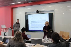 John Pavolotsky and Svetlana Matt speak in a classroom.