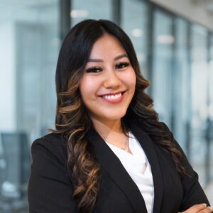 This is a headshot of 2L Marilyn Aguilar-Portillo wearing a white shirt and black blazer.