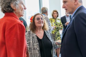 Toni Young talking with her fellow Half-Century Club members